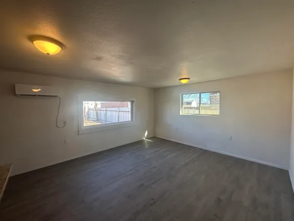 an empty room with a empty space and window