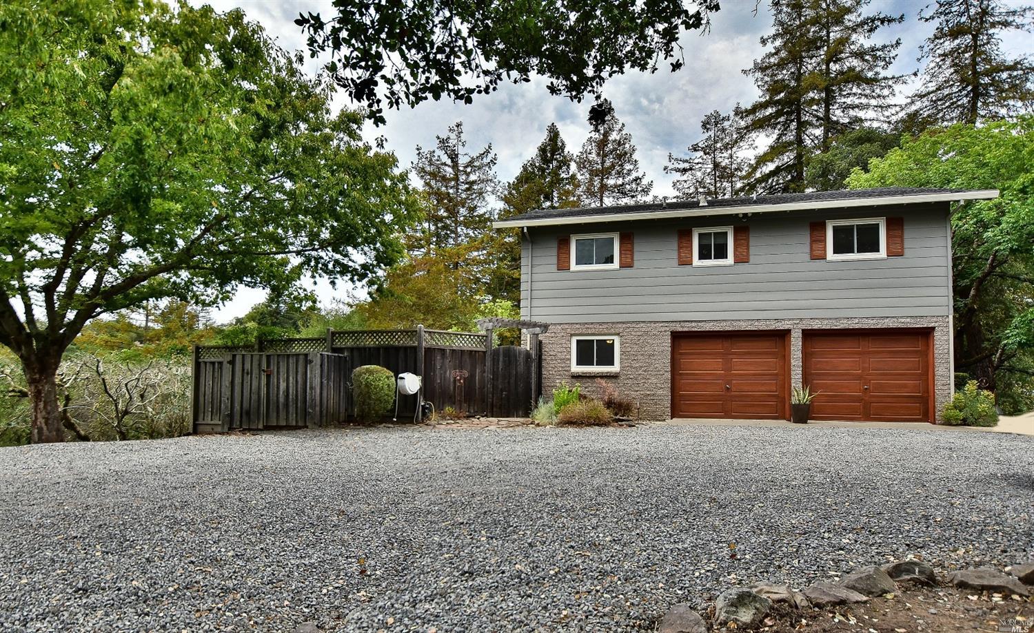 2277 Crane Canyon Road Santa Rosa, CA 95404 - Photo 1 of 1 a front view of a house with a yard and garage