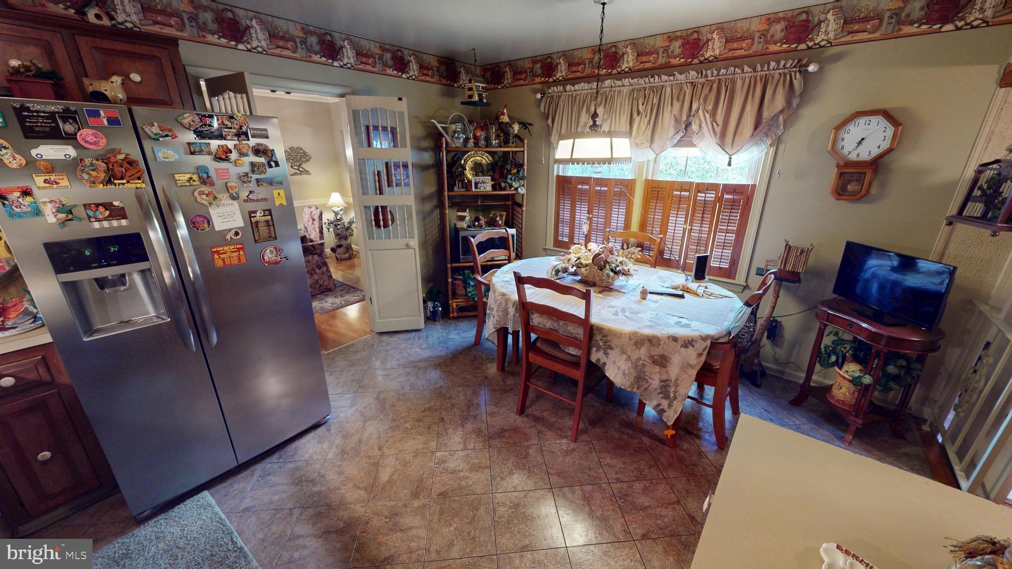 6911 Good Luck Road Hyattsville, MD 20784 - Photo 23 of 94 a view of a dining room with furniture window and outside view