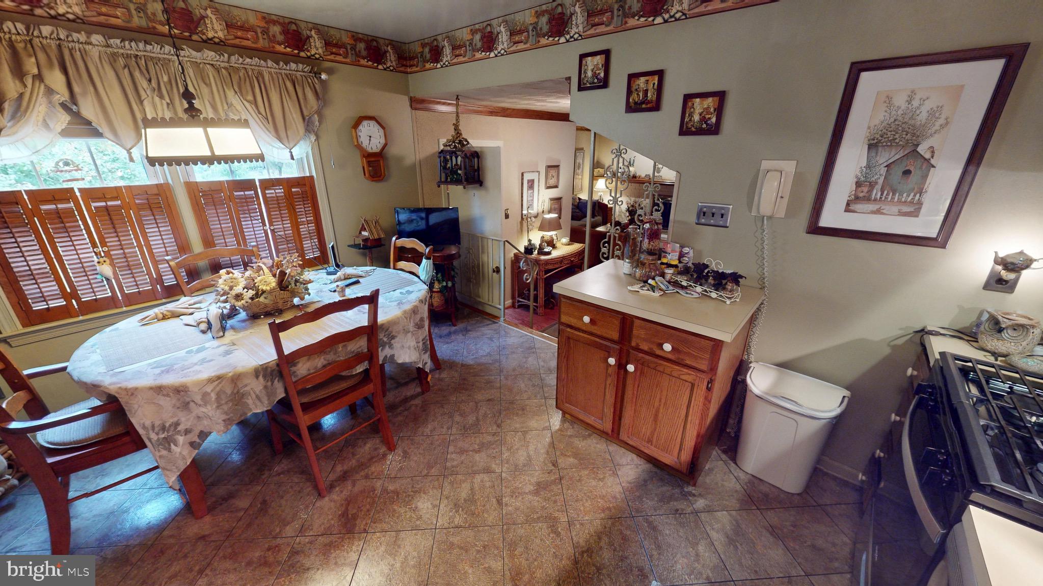 6911 Good Luck Road Hyattsville, MD 20784 - Photo 24 of 94 a reading room with furniture a window and a fireplace