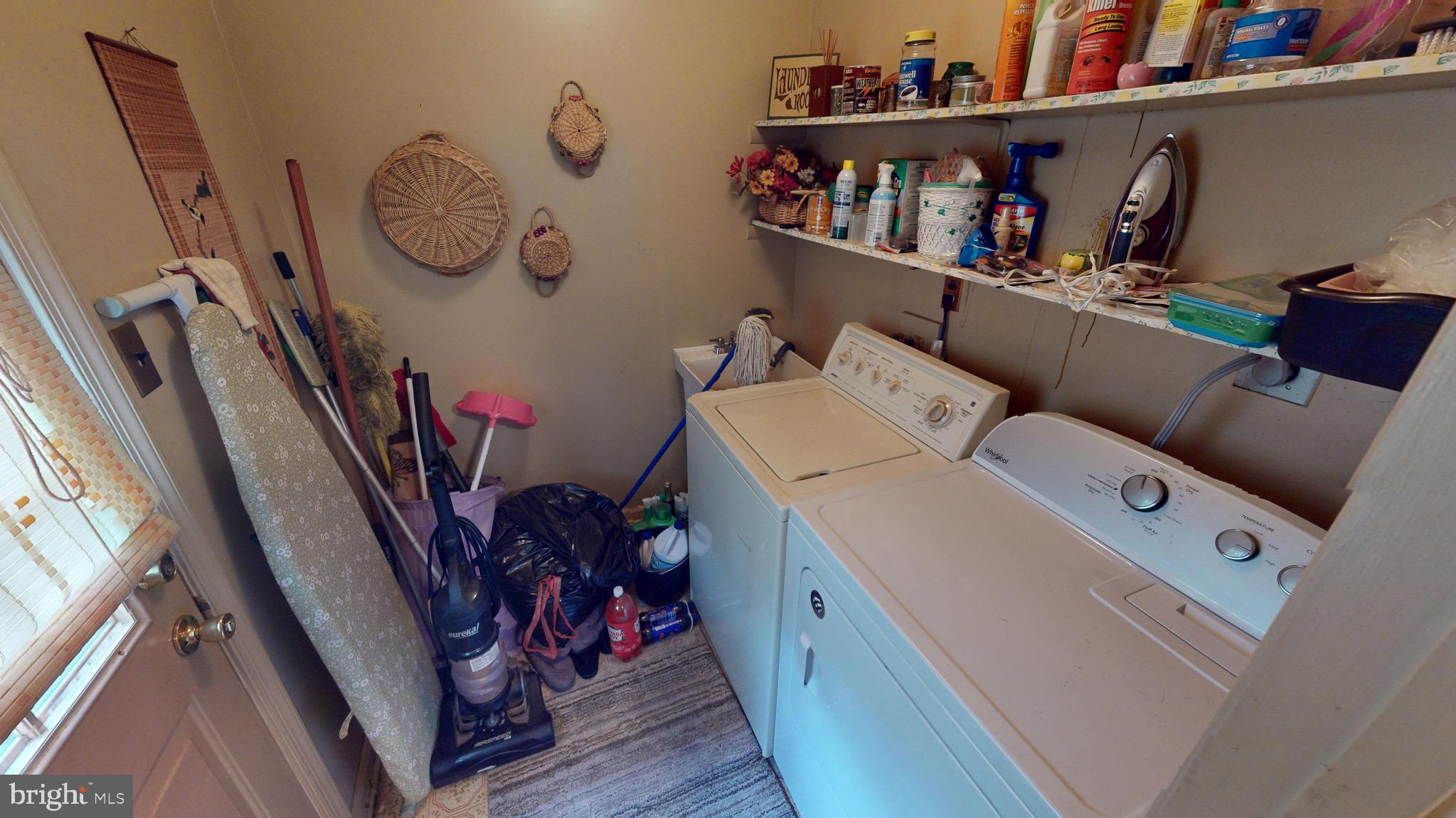 6911 Good Luck Road Hyattsville, MD 20784 - Photo 27 of 94 a view of storage and utility room with racks on the wall