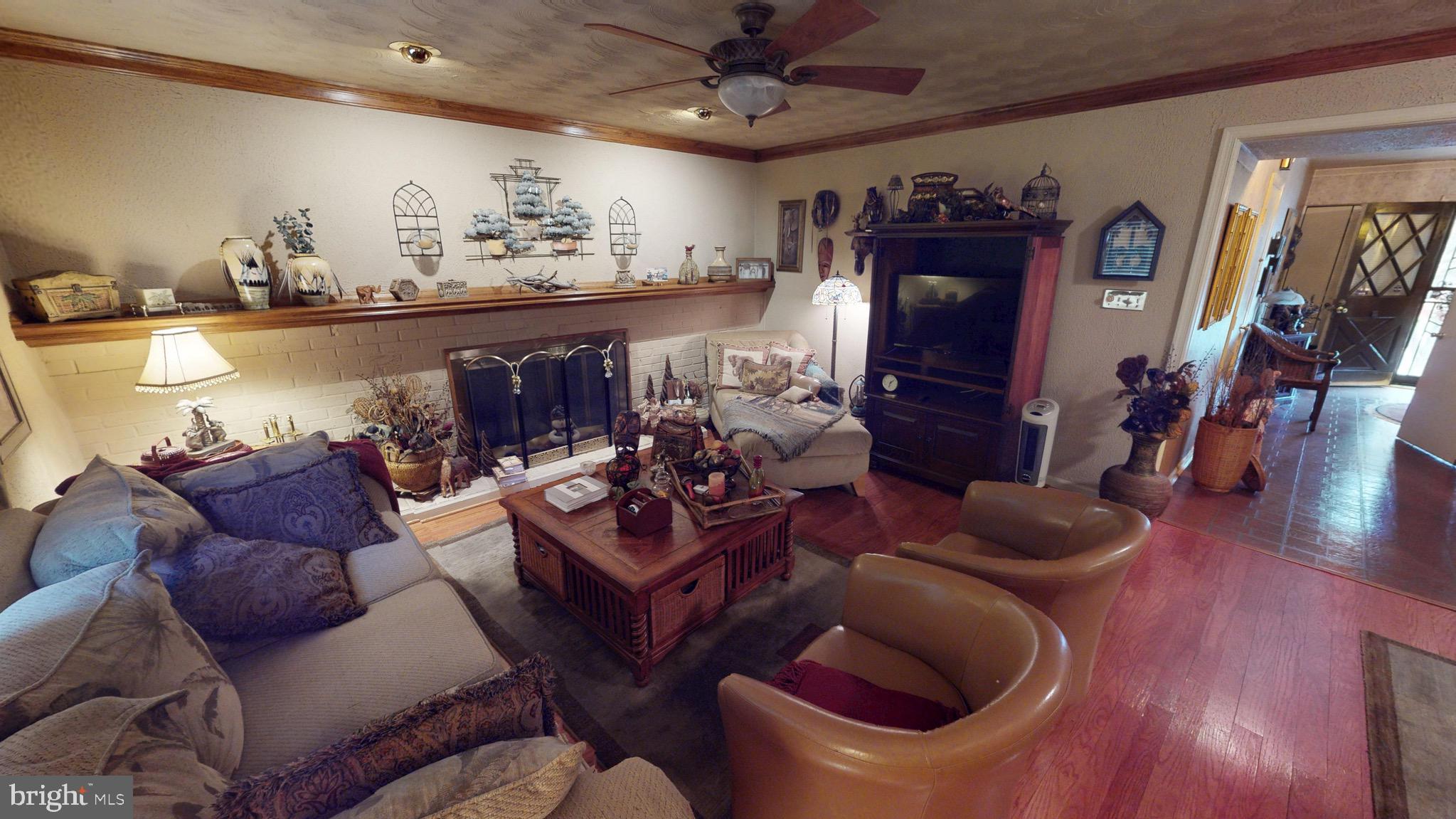 6911 Good Luck Road Hyattsville, MD 20784 - Photo 32 of 94 a living room with furniture and wooden floor