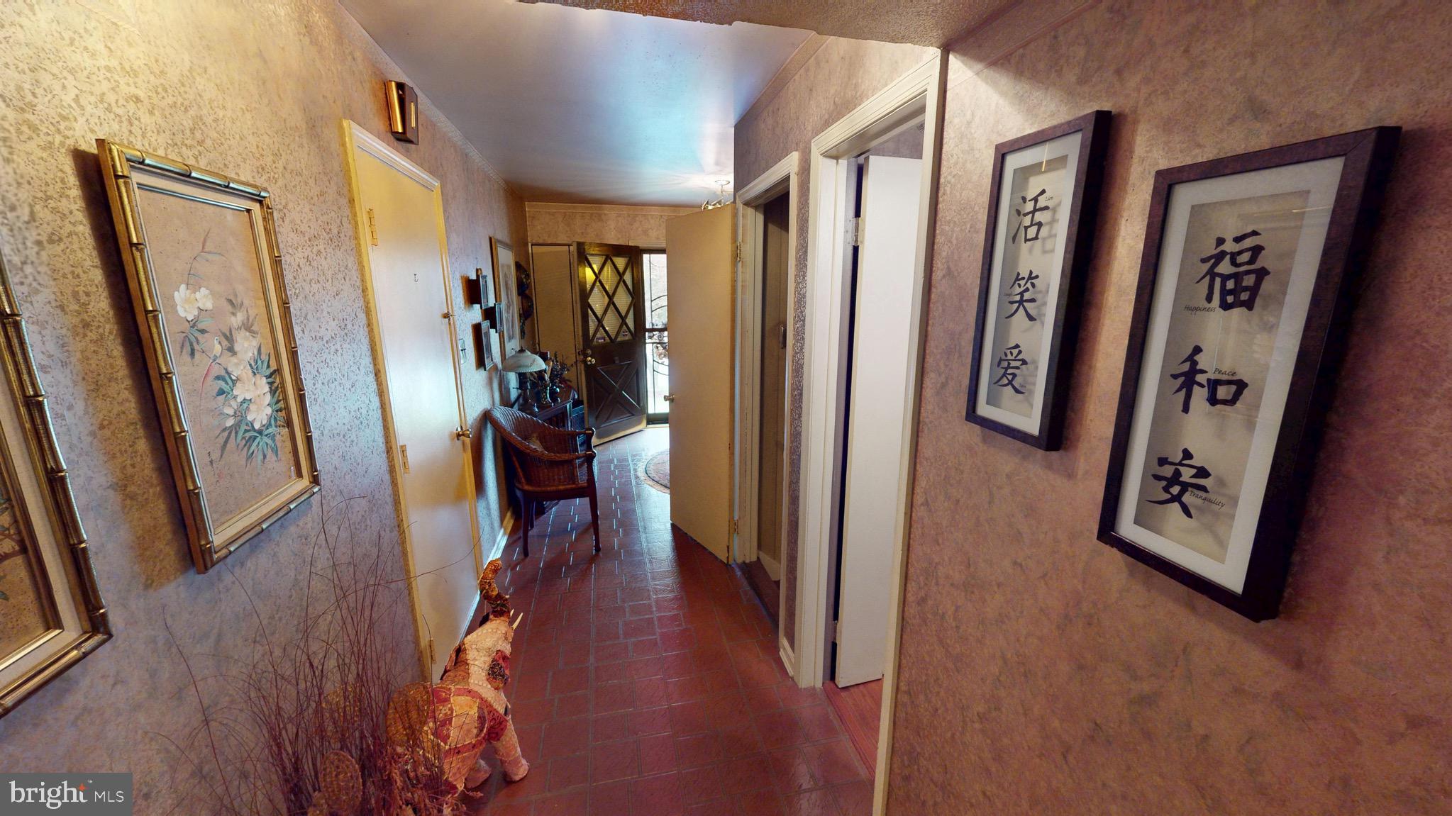 6911 Good Luck Road Hyattsville, MD 20784 - Photo 37 of 94 a view of a hallway with wooden floor and livingroom