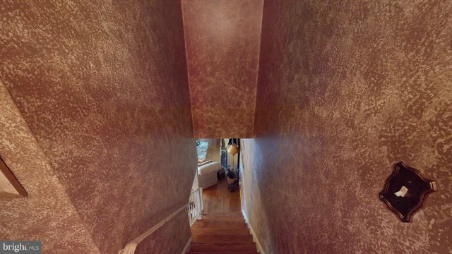 a living room with furniture a window and a chandelier