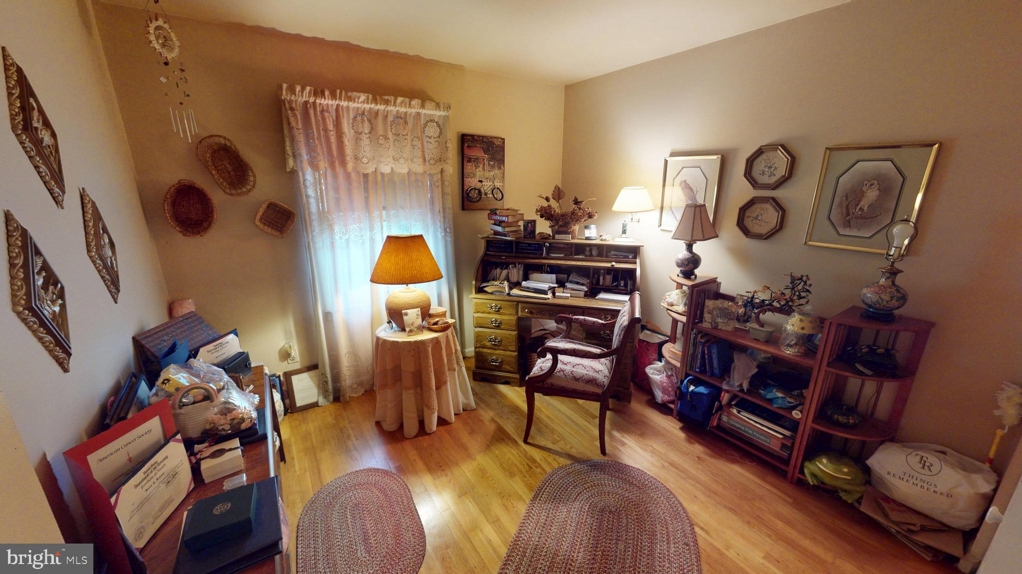 6911 Good Luck Road Hyattsville, MD 20784 - Photo 43 of 94 a living room with furniture and a table