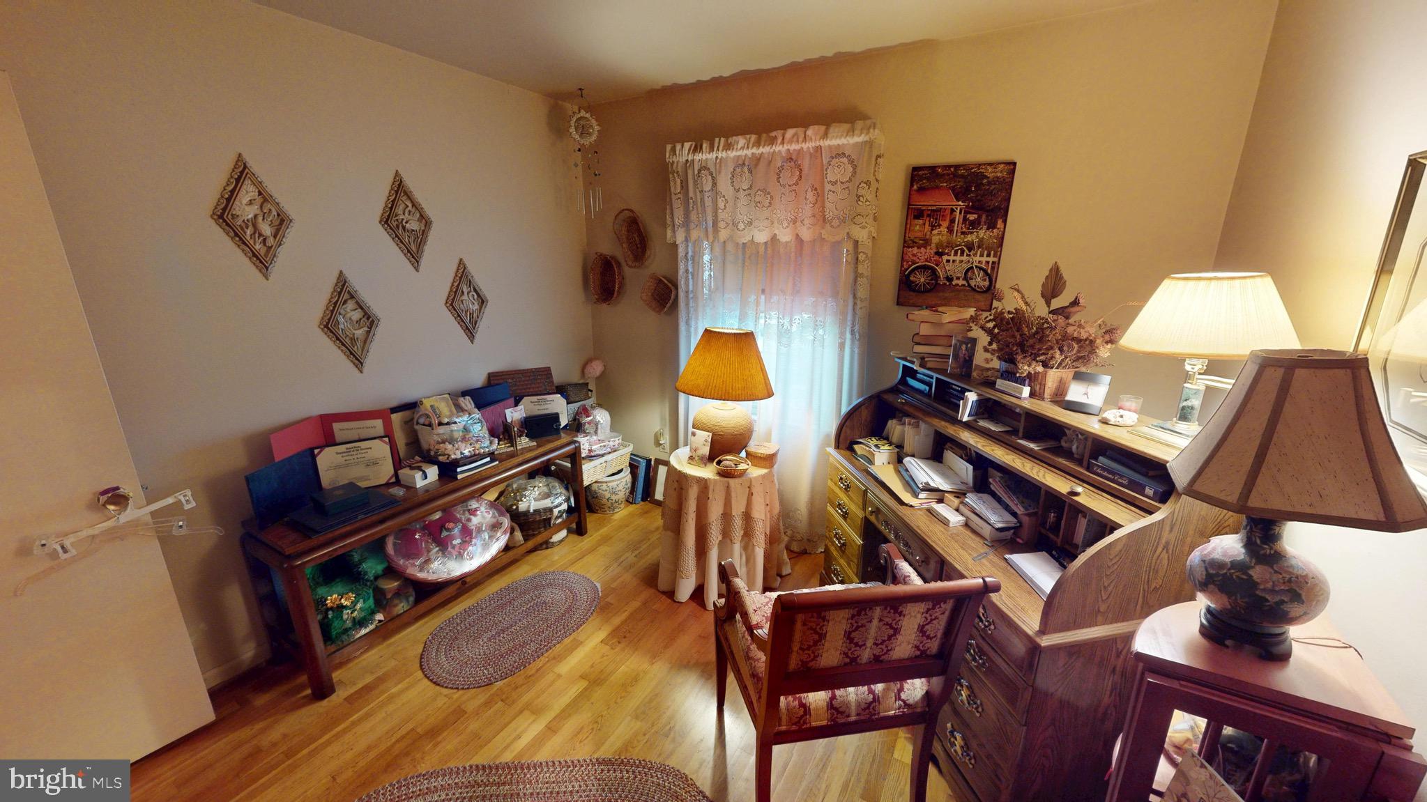 6911 Good Luck Road Hyattsville, MD 20784 - Photo 45 of 94 a living room with furniture and wooden floor