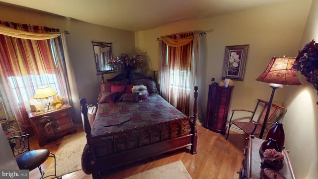 a bedroom with furniture and a lamp