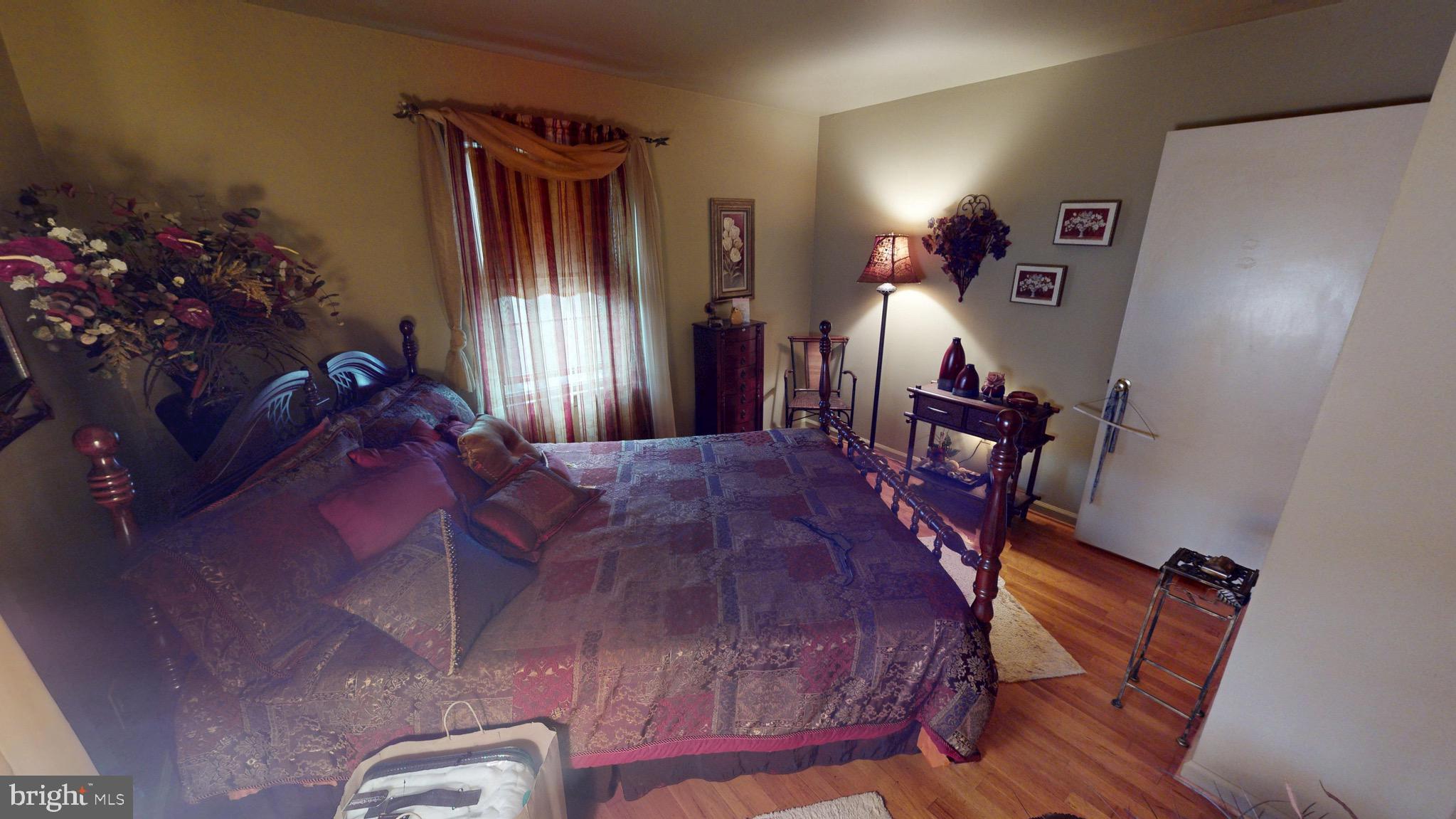 6911 Good Luck Road Hyattsville, MD 20784 - Photo 49 of 94 a bed sitting in a room next to a window