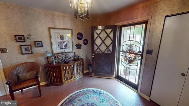 a living room with furniture fireplace and wooden floor