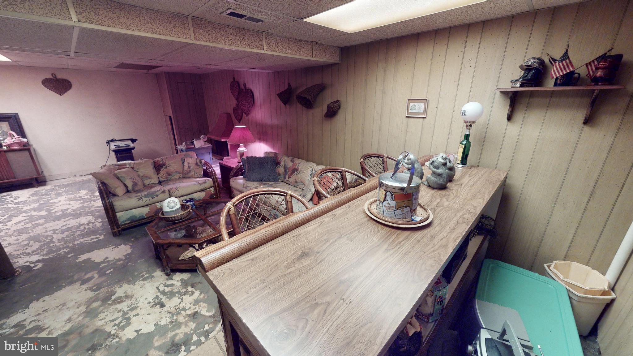 6911 Good Luck Road Hyattsville, MD 20784 - Photo 76 of 94 a view of a dining room with furniture and chandelier