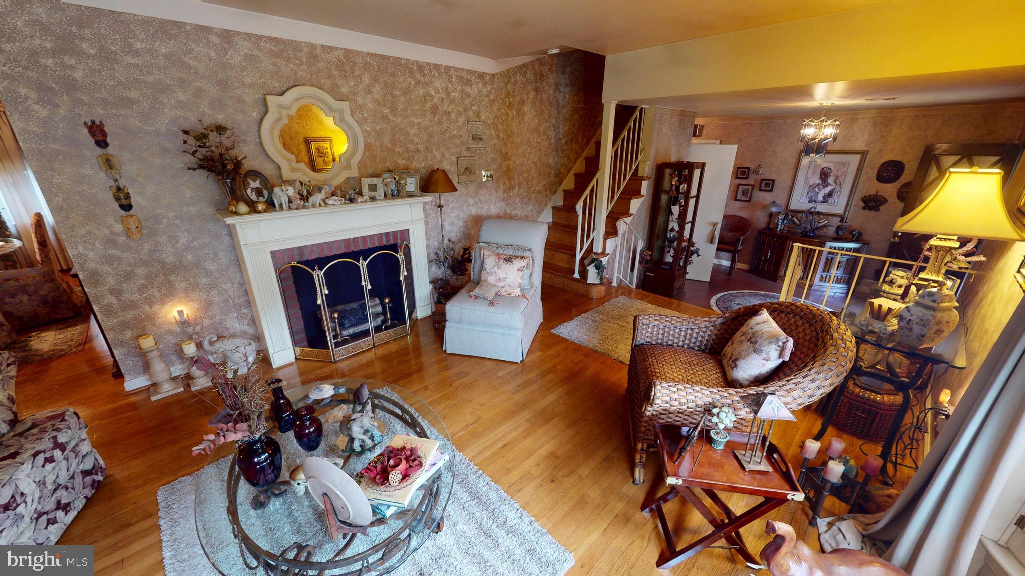 6911 Good Luck Road Hyattsville, MD 20784 - Photo 10 of 94 a living room with furniture and a fireplace