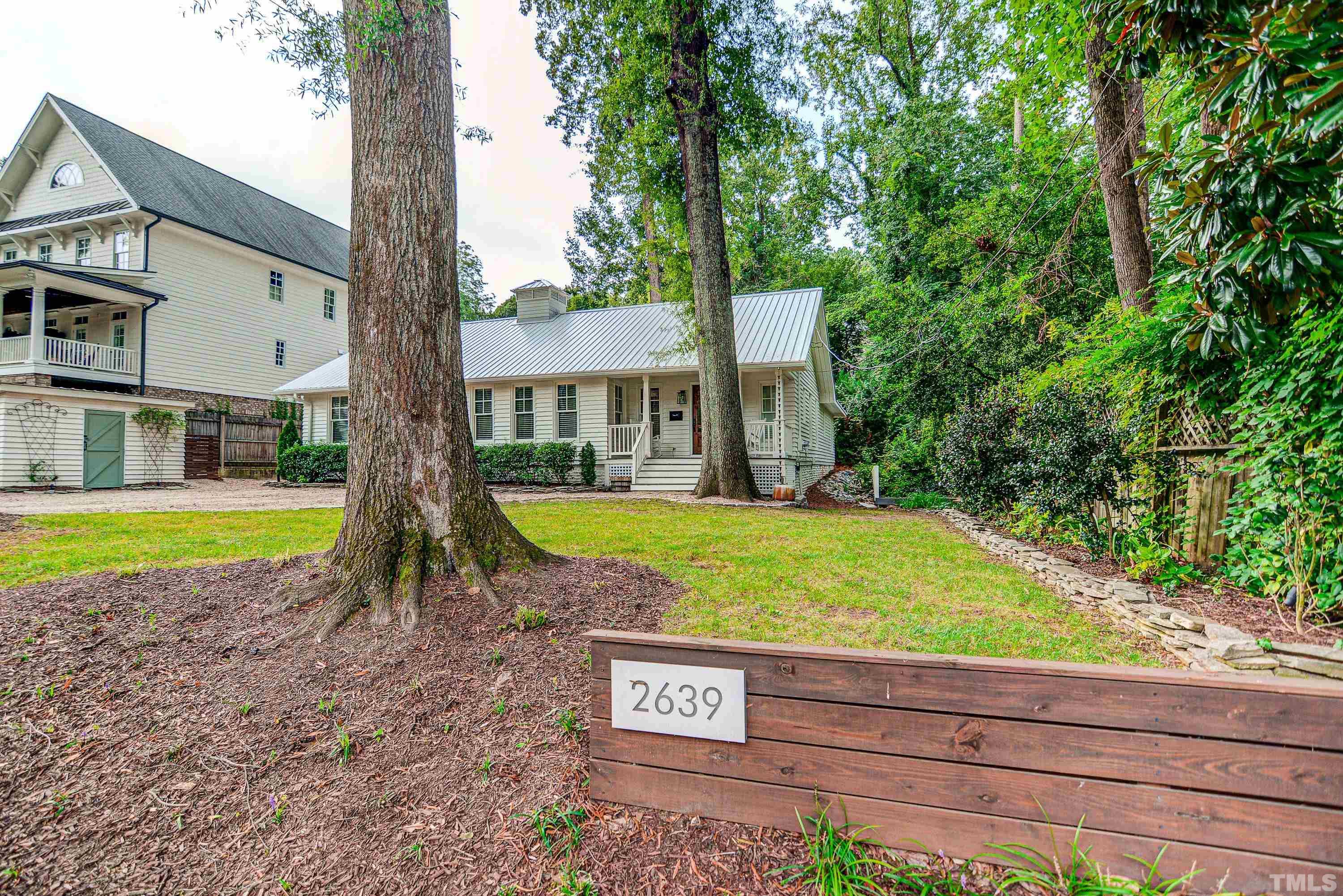 2639 Davis Street Raleigh, NC 27608 - Photo 2 of 35 a view of a house with a yard and sitting area