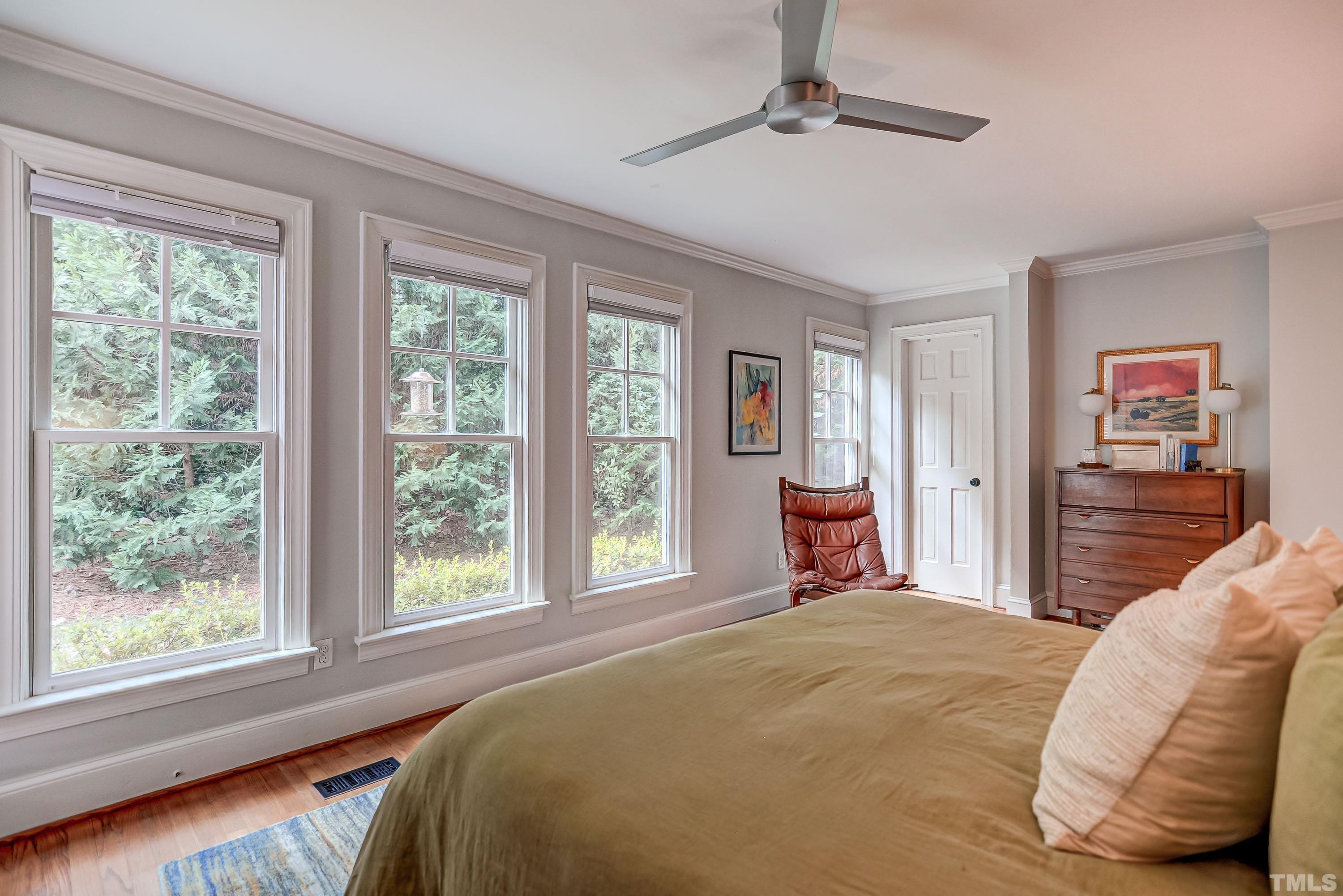2639 Davis Street Raleigh, NC 27608 - Photo 21 of 35 a bedroom with a bed and wooden floor