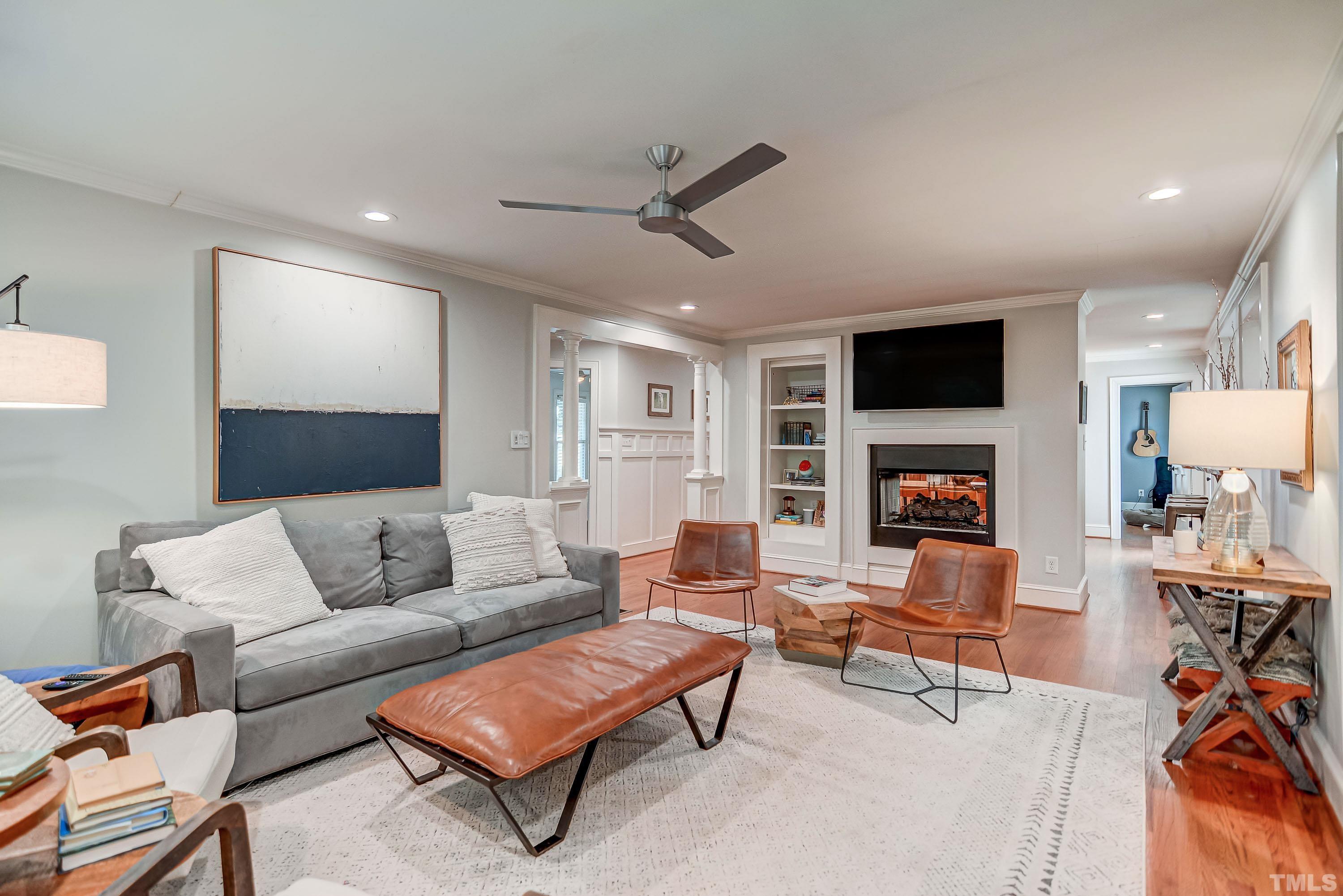 2639 Davis Street Raleigh, NC 27608 - Photo 6 of 35 a living room with furniture and a flat screen tv