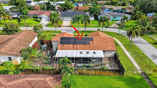 an aerial view of a house with a garden