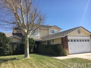 13665 Hidden Valley Road Victorville, CA 92395 - Photo 1 of 1 a front view of a house with a yard