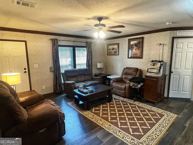 a living room with furniture rug and window