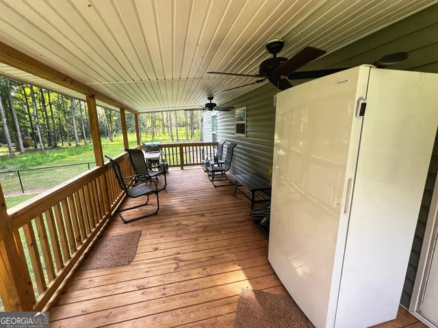 a view of a porch with wooden floor