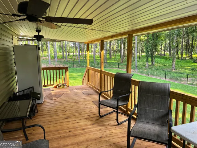 a view of a patio with table and chairs