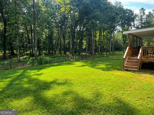 a view of a swimming pool with a patio
