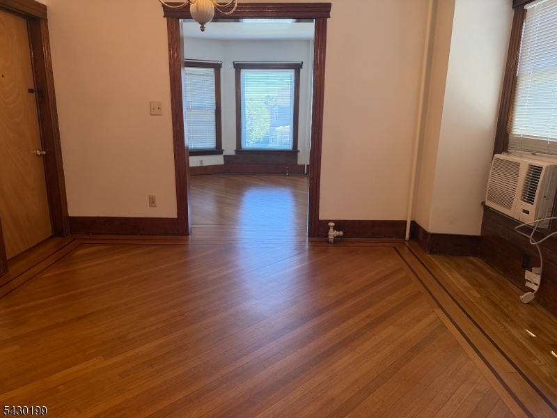72 Baldwin Place, Unit 2 Bloomfield, NJ 07003 - Photo 11 of 24 a view of a room with wooden floor and a sink