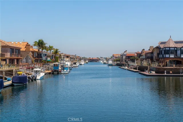 a view of a lake with boats and trees in the background