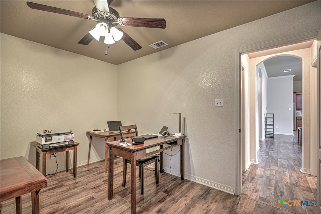 8405 Split Trl Cove Temple, TX 76502 - Photo 27 of 37 a view of a workspace with furniture and a chandelier