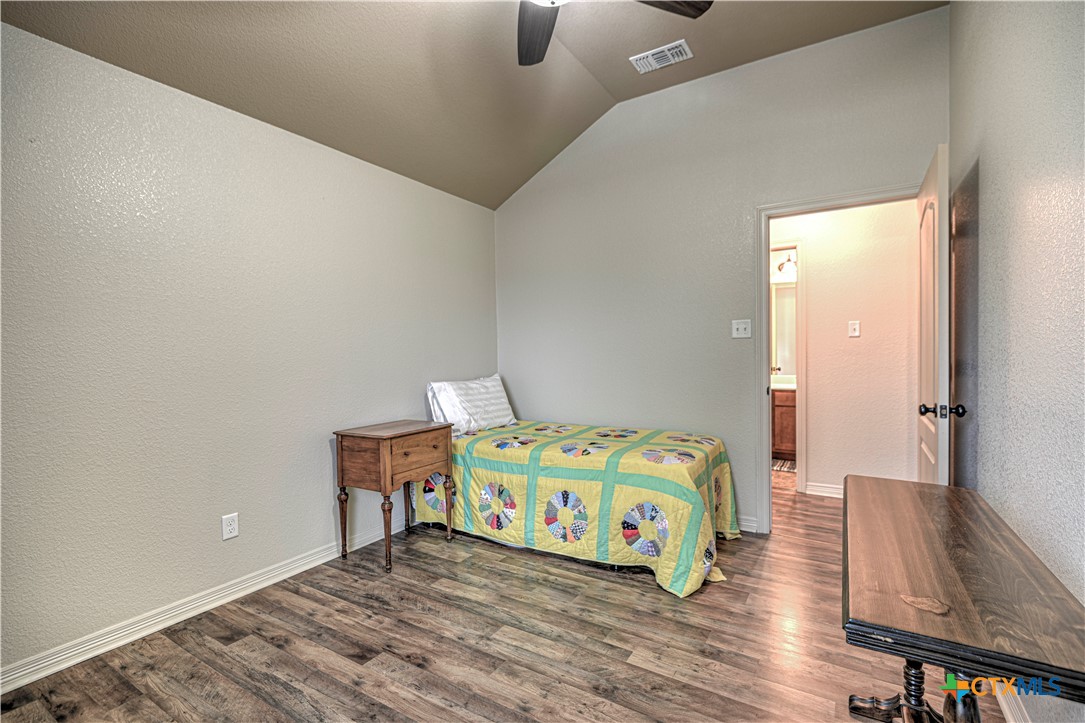 8405 Split Trl Cove Temple, TX 76502 - Photo 29 of 37 a bedroom with bed and wooden floor