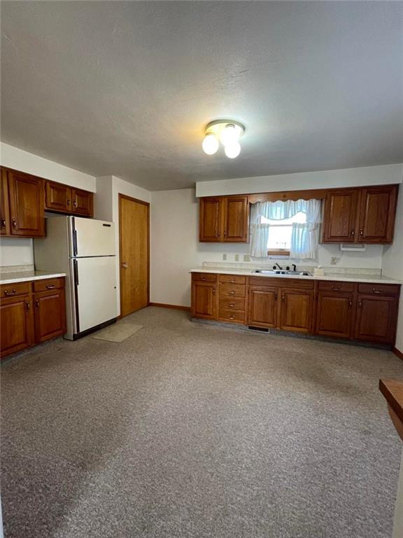 1409 Mission Road Latrobe, PA 15650 - Photo 3 of 8 a view of a kitchen with furniture and a sink