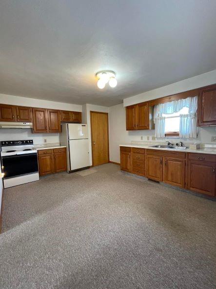 1409 Mission Road Latrobe, PA 15650 - Photo 4 of 8 a large kitchen with a stove and a refrigerator