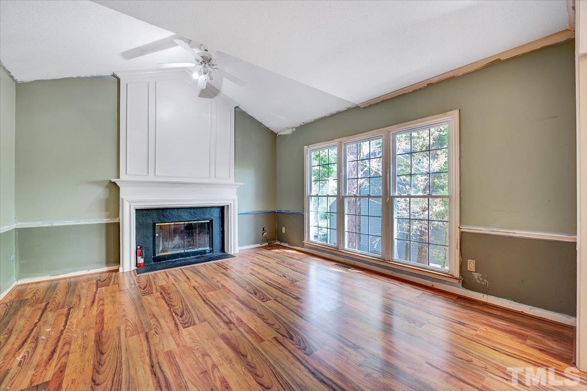 4003 Kettering Drive Durham, NC 27713 - Photo 11 of 28 a view of an empty room with wooden floor and a window