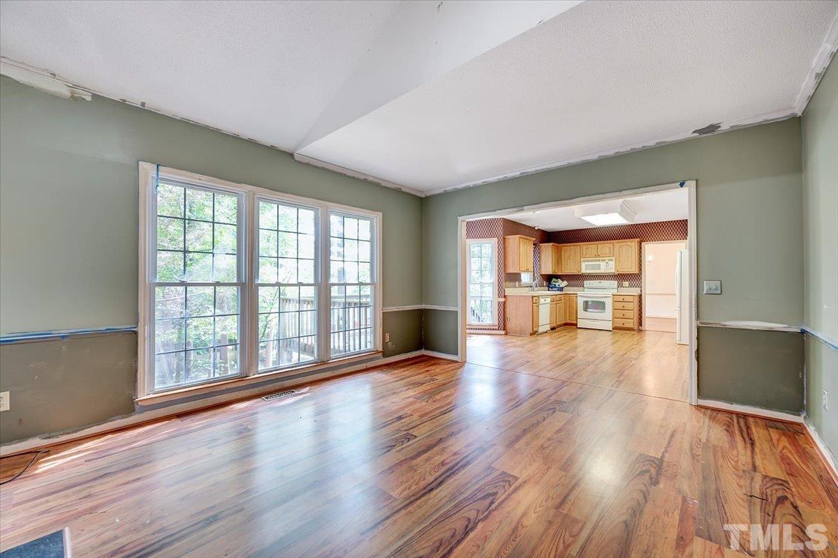 4003 Kettering Drive Durham, NC 27713 - Photo 12 of 28 wooden floor in an empty room with a window