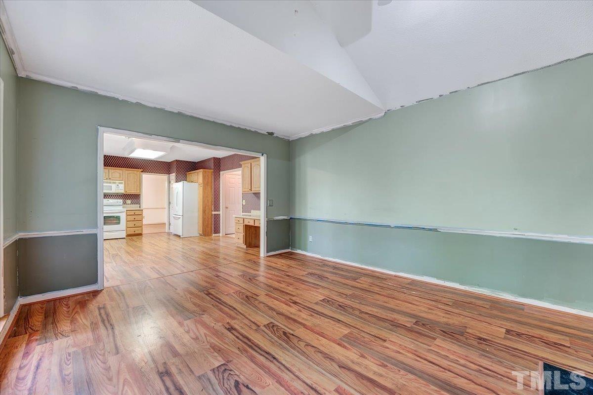 4003 Kettering Drive Durham, NC 27713 - Photo 13 of 28 a view of empty room with wooden floor and fan