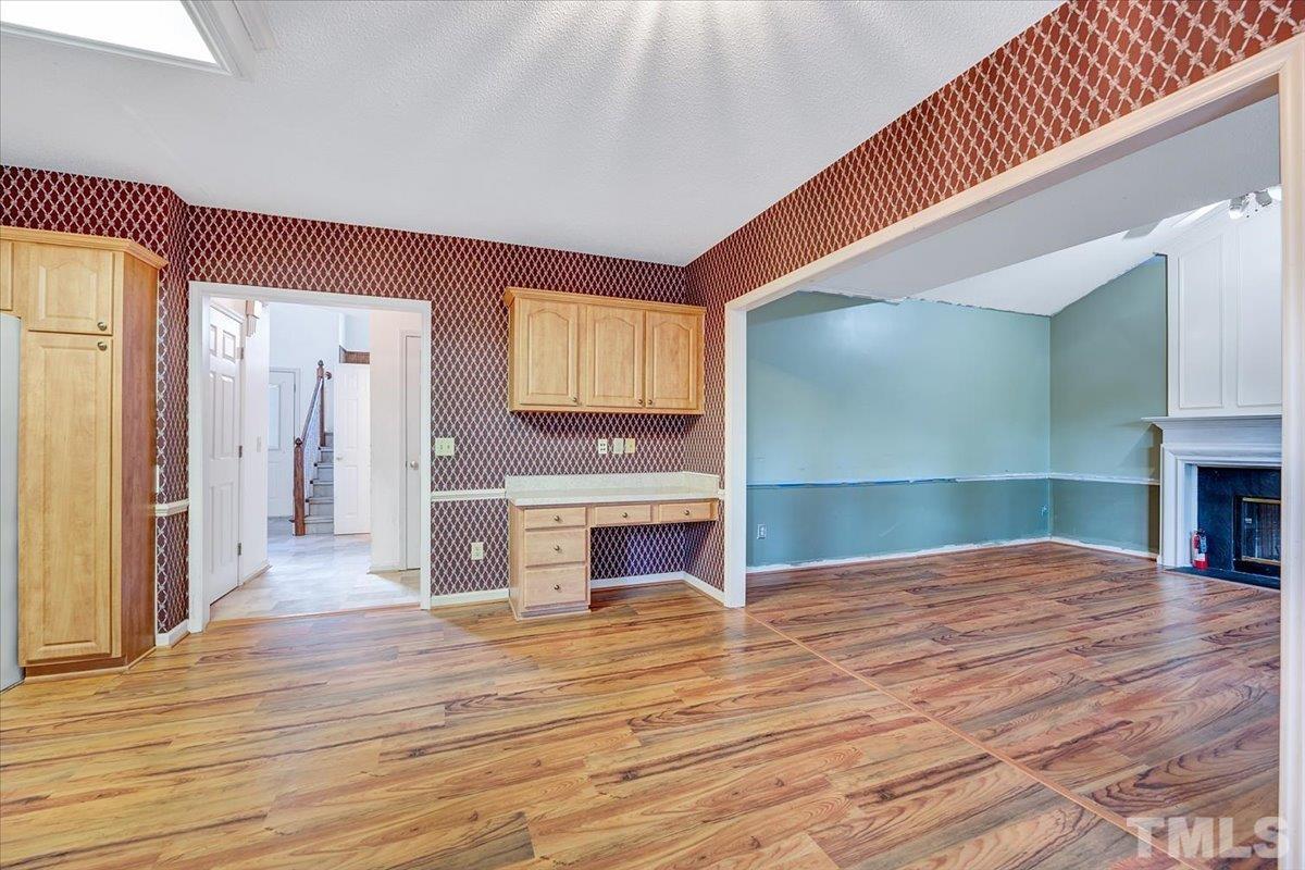 4003 Kettering Drive Durham, NC 27713 - Photo 14 of 28 a view of livingroom with kitchen and fireplace