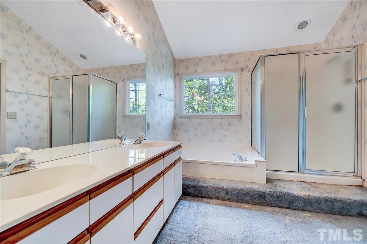 4003 Kettering Drive Durham, NC 27713 - Photo 21 of 28 a bathroom with a double vanity sink and a mirror