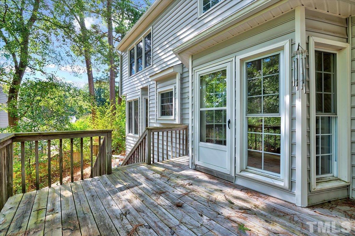 4003 Kettering Drive Durham, NC 27713 - Photo 22 of 28 a view of a brick house with large windows and wooden floor