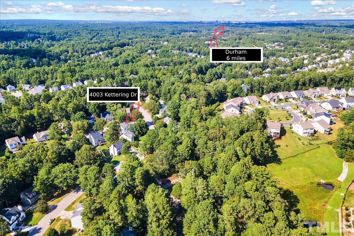 4003 Kettering Drive Durham, NC 27713 - Photo 28 of 28 a view of a city with lush green forest