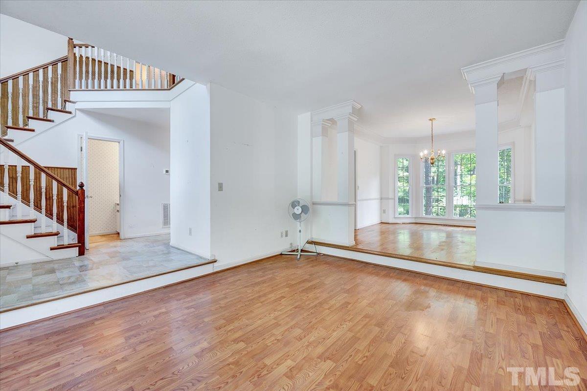 4003 Kettering Drive Durham, NC 27713 - Photo 3 of 28 a view of an empty room with wooden floor and a window