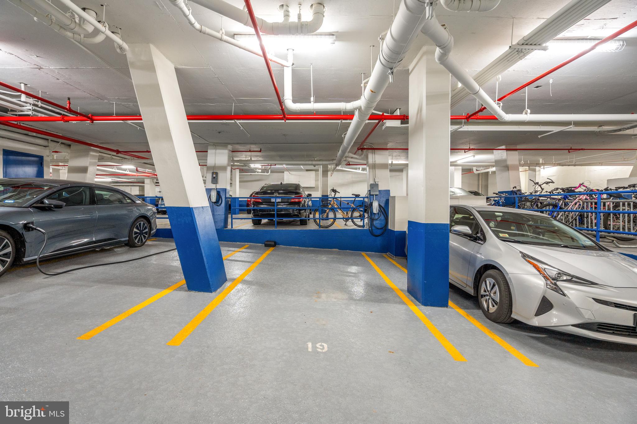 955 26th Street Northwest, Unit 707 Washington, DC 20037 - Photo 15 of 26 a view of parking garage with cars parked