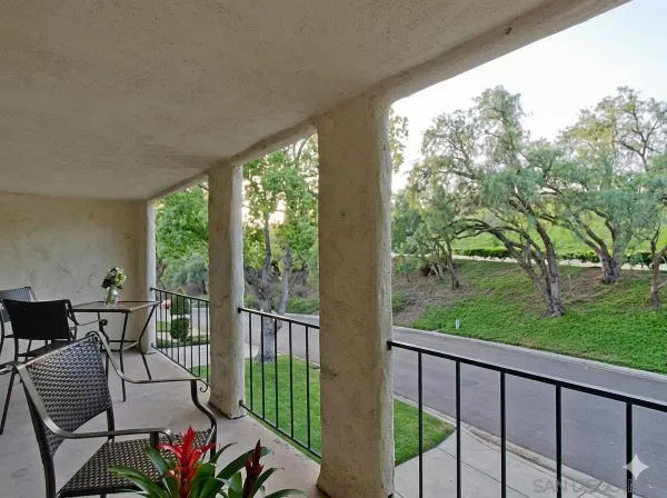 a view of a two chairs in the deck
