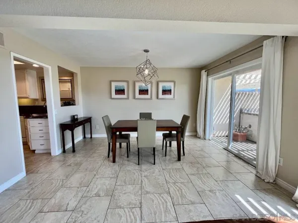 a view of a dining room with furniture window and outside view