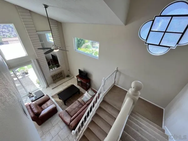 a view of living room with furniture and a window