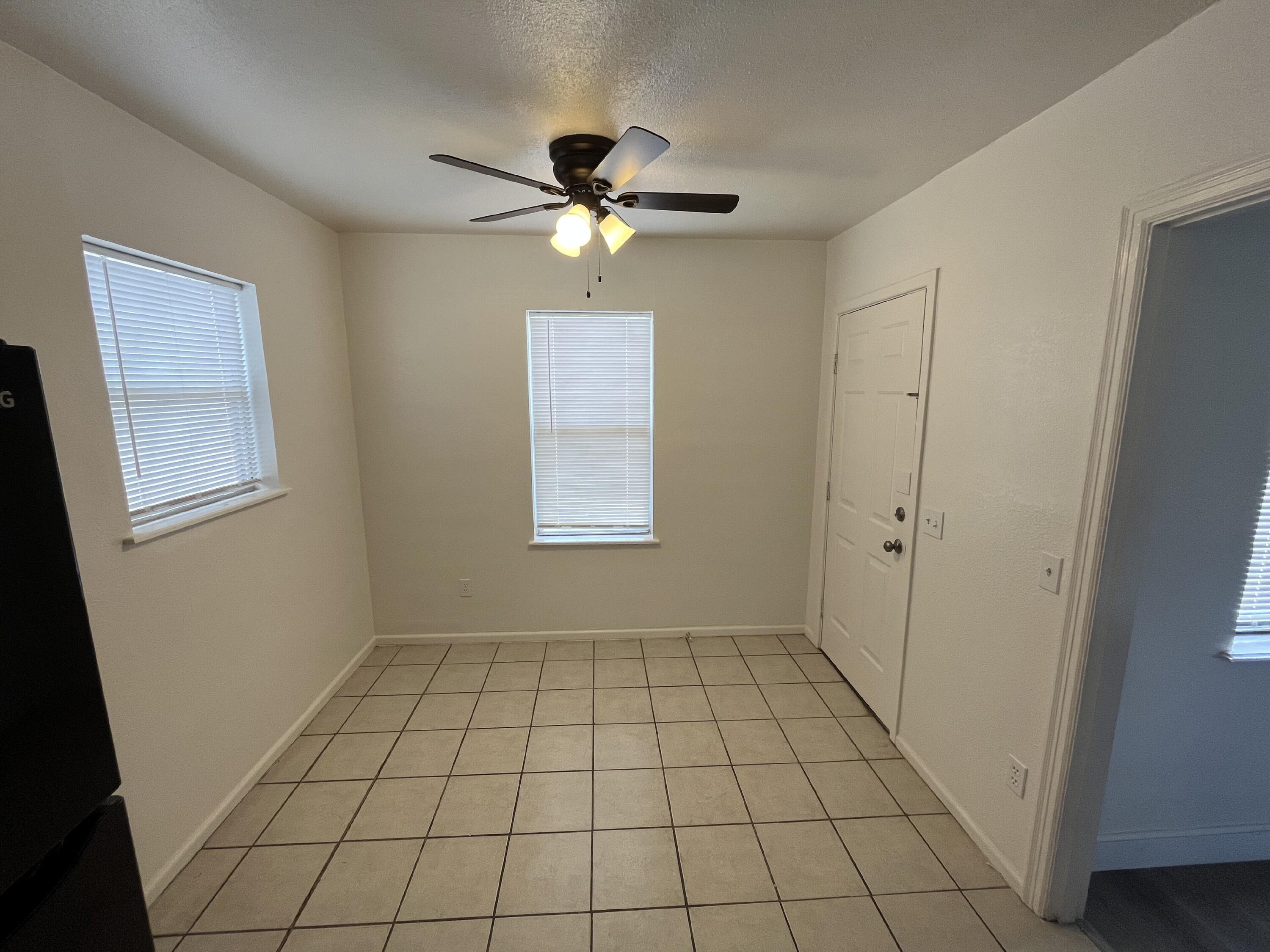 3404 30th Street Lubbock, TX 79410 - Photo 4 of 13 a view of an empty room with a window