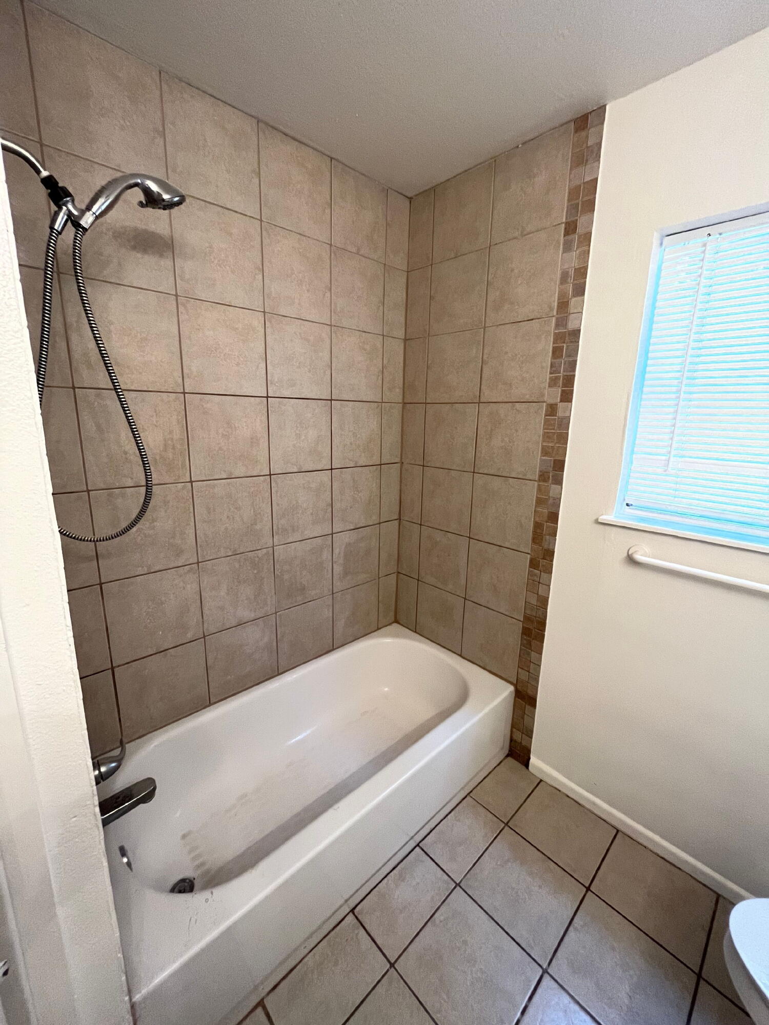 3404 30th Street Lubbock, TX 79410 - Photo 9 of 13 a bathroom with a bathtub