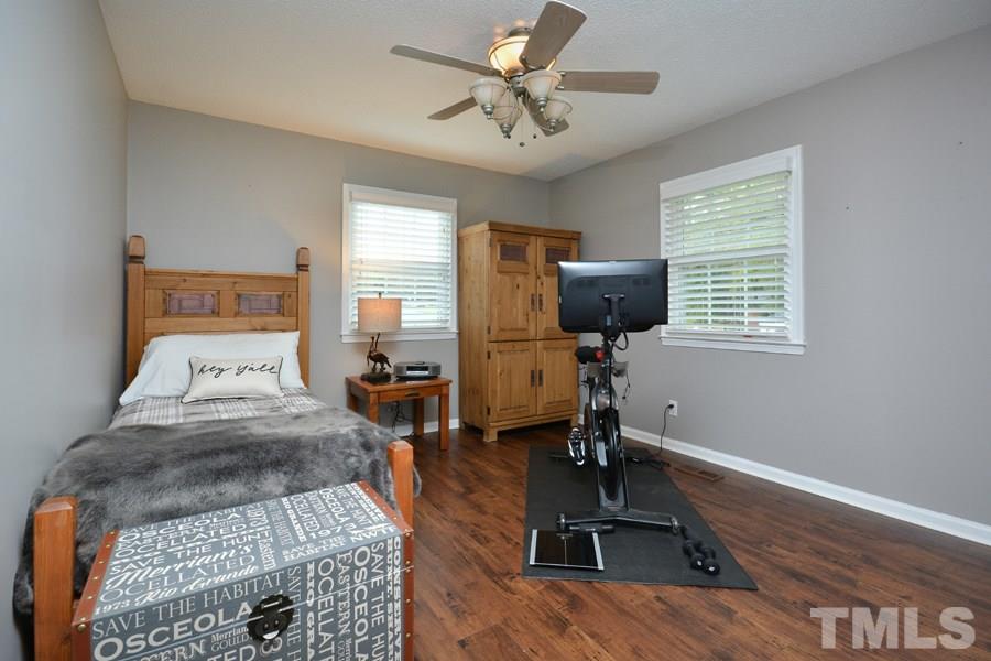2260 Sanders Road Stem, NC 27581 - Photo 13 of 30 a bed room with a bed furniture and a window