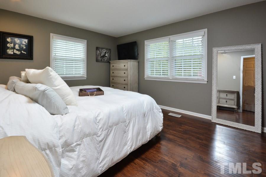 2260 Sanders Road Stem, NC 27581 - Photo 16 of 30 a bedroom with a bed and a window