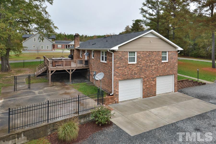 2260 Sanders Road Stem, NC 27581 - Photo 20 of 30 a front view of a house with garden