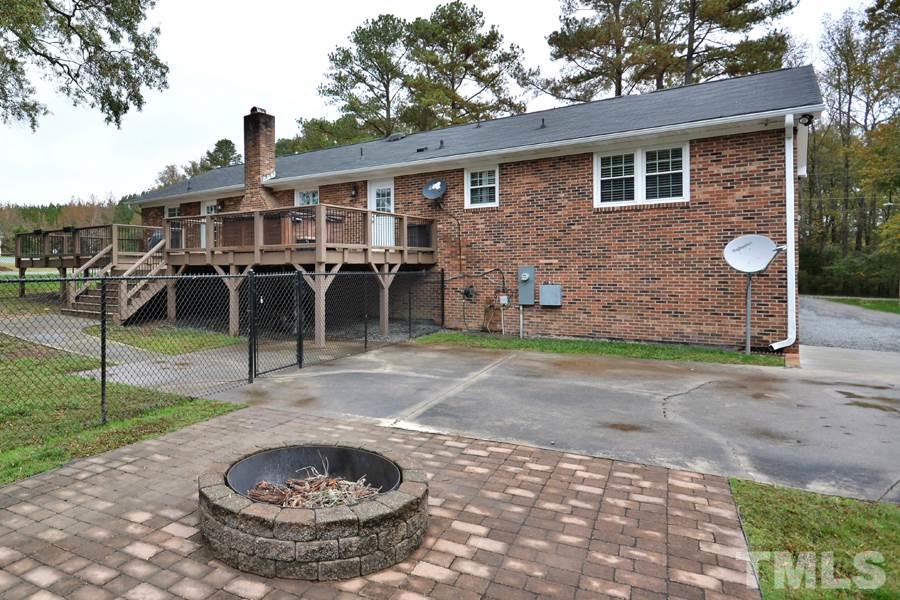 2260 Sanders Road Stem, NC 27581 - Photo 22 of 30 a view of a house with backyard
