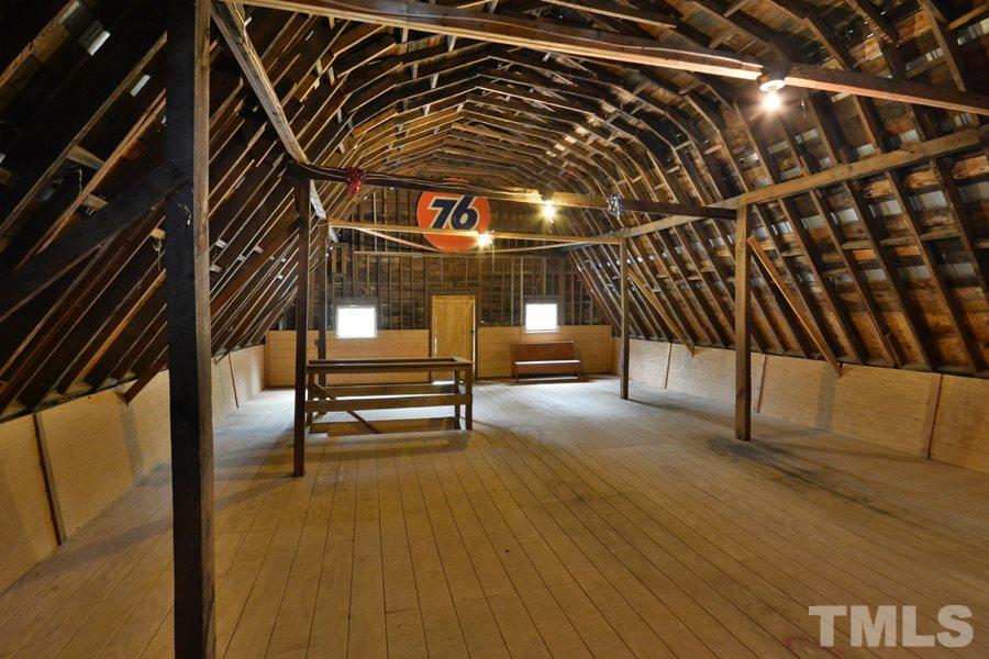 2260 Sanders Road Stem, NC 27581 - Photo 30 of 30 a view of an empty room with wooden floor