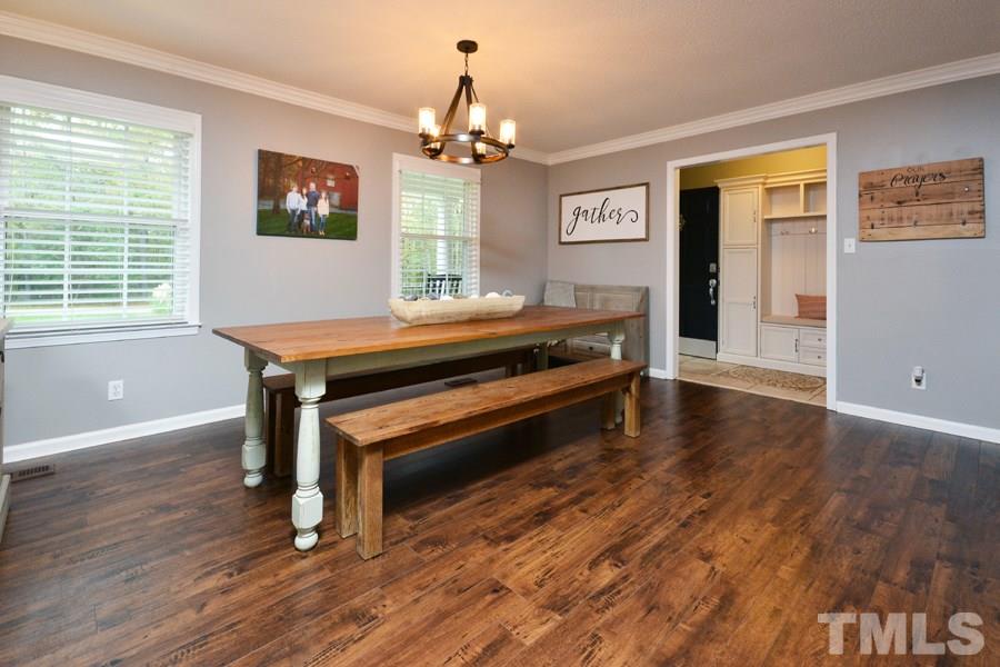 2260 Sanders Road Stem, NC 27581 - Photo 6 of 30 a view of a dining room with furniture window and wooden floor